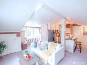 An apartment above the garage is self-contained with a sleeping area, 3/4 bath and kitchen.