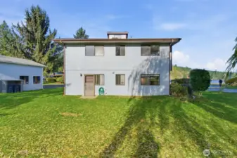 Back of home and level back yard