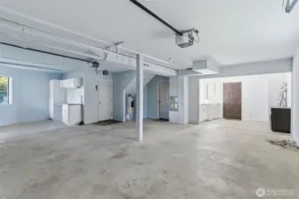 Large 2-car garage with laundry on the right, workshop on the left