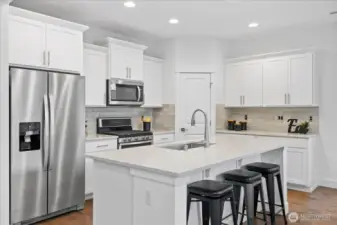Meal prep is easy at your beautiful kitchen island with room for seating!