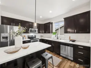New quartz countertops, sink, faucet and lighting fixtures.