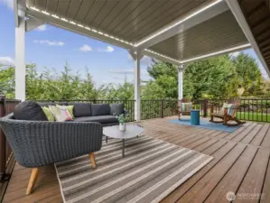 New TimberTeck deck, railing, and pergola with remote louvered roof, sunshades & lighting.