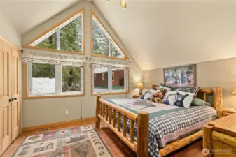 Upper level Primary Suite! Vaulted ceilings and lovely views.