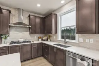 Gas cooktop, love the window at the kitchen sink!