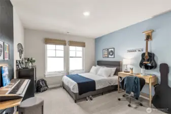 Spacious upstairs bedroom with fun accent walls!
