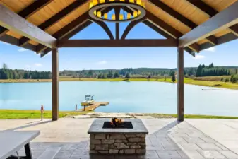 An evening glass of wine looking over the dancing flames on the heated Patio. Year-round outdoor enjoyment.