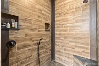Multiple shower heads in the primary bath suite