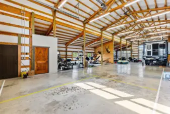 Shopspace provides ample room for all the toys, tack, weight room. Horse stall area, kennel and lots of storage.