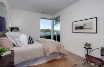 This is one of two bedrooms on lower level. Each bedroom has a wonderful view and shares a large 3/4 bath. Enjoy the views of Eagle Harbor from your morning shower!