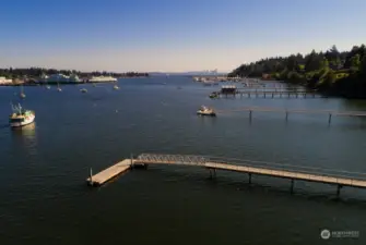 A cool shot of the dock looking east via drone: Bainbridge Ferry Terminal and "The Emerald City" in the distance. Wow!