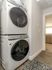 Laundry room currently houses stack wash and dryer with storage shelves built next to them leaving room for laundry hampers and baskets too! You can have the washer and dryer next to each other also... which ever you prefer!