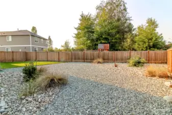 Very low maintenance backyard is full of potential and so much privacy! Beautiful grass area also!