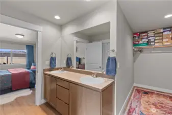 Primary bath and a peak at walk in closet