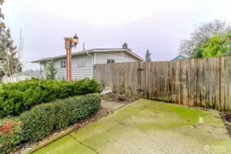 Side driveway and gate to patio.