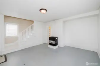 Living room with natural gas stove.