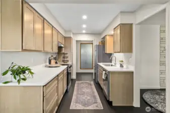 The kitchen is all new with beautiful cabinetry and solid surface countertops!