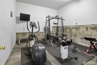 1/2 of one bay is converted to a home gym, heated, tv & equipment stay.