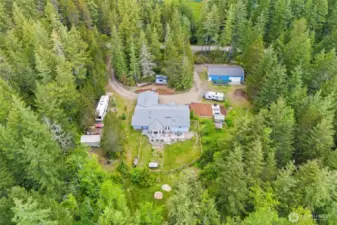 Square and Kitsap Level 2.32 acre parcel with a 1981 sqft stick built home, 2 car garage plus 24 X 48 shop Garen areas, Rv hook ups, fenced yards, etc...