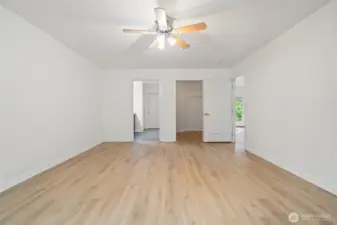 Primary bedroom with walk in closet and ensuite. The primary bedroom is on the opposite end of the home from the secondary bedrooms