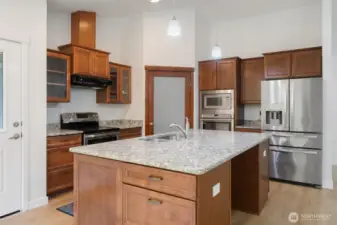 Nice kitchen with walk in pantry, 2 ovens, built in microwave and a large island with lots of space for cooking prep.