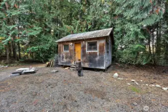Playhouse, studio, she shed?  Has potential for power and wood stove can be replaced if desired