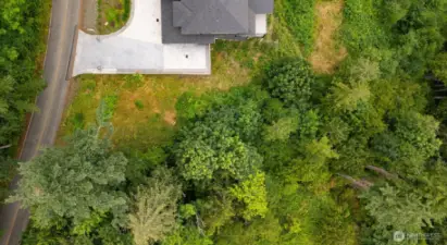 Looking down on this parcel between two lovely homes.
