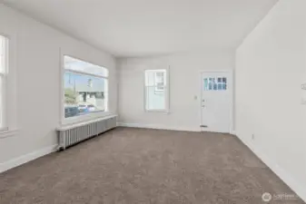 Upper-level living room with fresh paint and carpet!