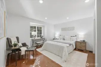 Another secondary bedroom offering hardwoods (seller used as library), coved front window overlooking beautiful & colorful trees & added canned lighting.  Wonderful room next door to Primary bedroom.