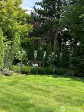 Tons of mature planting and trees making a fully private backyard.