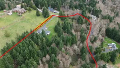A good amount of the 7.6 acres is a tree grove, primarily Doug Fir