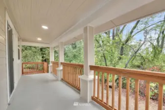 Large covered back deck to enjoy year round!
