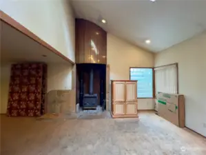 Family Room | The woodstove passively pumps to heat a radiant floor heat system.