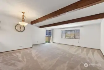 Living and dining room with decorative beams