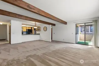 living and dining room looking towards the kitchen. Balcony slider also