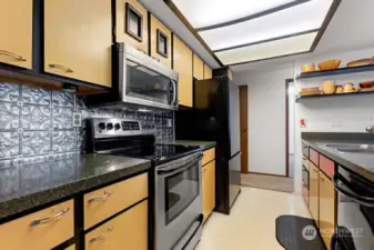 The Galley kitchen with designer touches. All appliances stay!