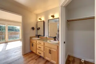 Primary suite with full bath, jetted tub, walk in shower and walk in closet.