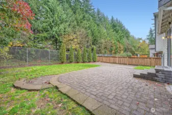 Fully-fenced 9,000 sqft yard with privacy hedge.