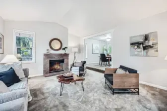 Sunken living room with wood burning fireplace.