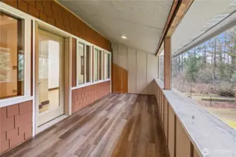 Covered deck off second bedroom.