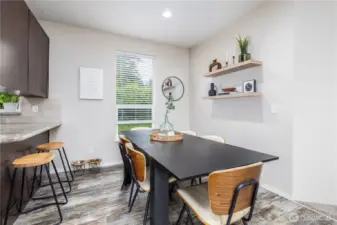 Large dining room table has plenty of space in this dining area.
