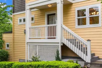 The formal covered entry leads up to the main living area. You can also enter through the 2 car garage on the lower level.