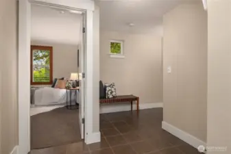 On the lower level is a large tiled entry off the garage as well as the third bedroom.