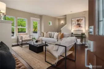 The formal entry opens up to this enormous living room with new paint and hardwood floors.