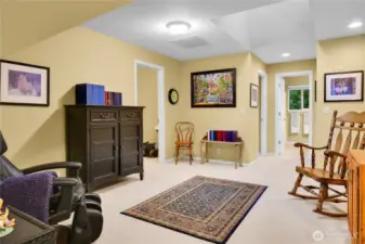 Upper level flex room with pony-wall overlook into the entry foyer, skylighted ceiling. Neutral carpet. Desk alcove with divided-light window and screen. Neutral carpet. Paneled Quaker door to additional office hideaway.