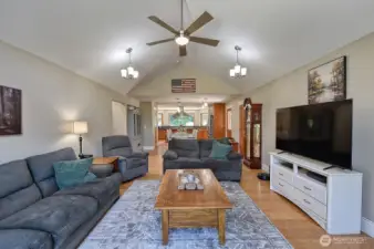 Another view of the living room facing towards the front door and kitchen.