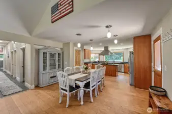 Entryway, dining area with the kitchen beyond.