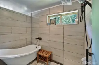 Shower and bath in en-suite bathroom.