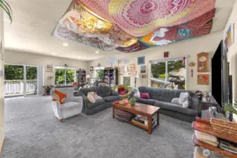 A spacious living room with a sliding door onto the back porch.
