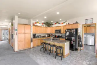 The laundry room and access to the garage is through the kitchen.