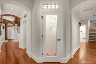 Pantry just off the kitchen. To the right is the mudroom to the 3-Car garage, Laundry Room, and stairs leading up to the Bonus Room. Head to the left for the Butlers Pantry, Formal Dining Room, Office and Primary Suite
